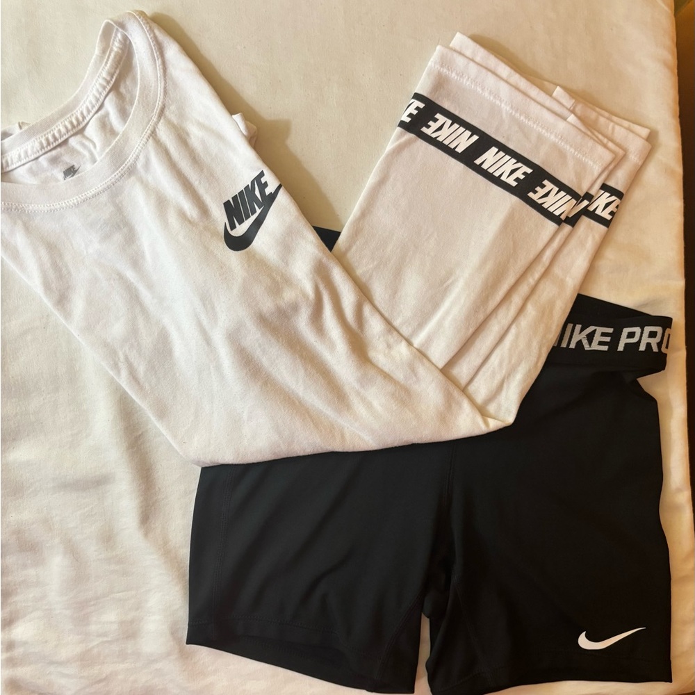 Nike White Tee with Light Pink Logo Trim and Black Nike Pro Shorts